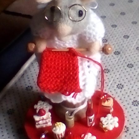 debby mouse busy knitting while surrounded with her little treats