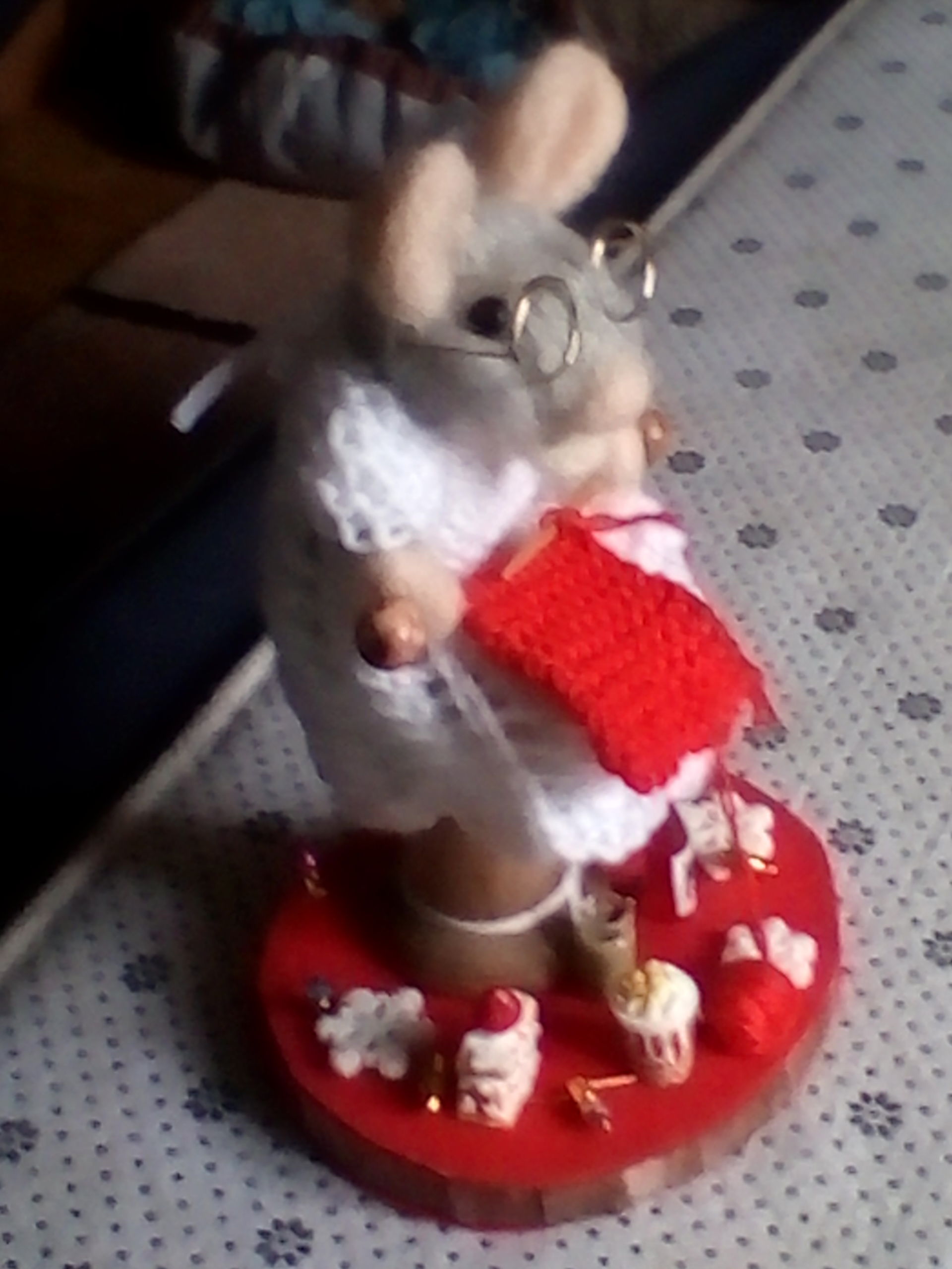 debby mouse busy knitting while surrounded with her little treats