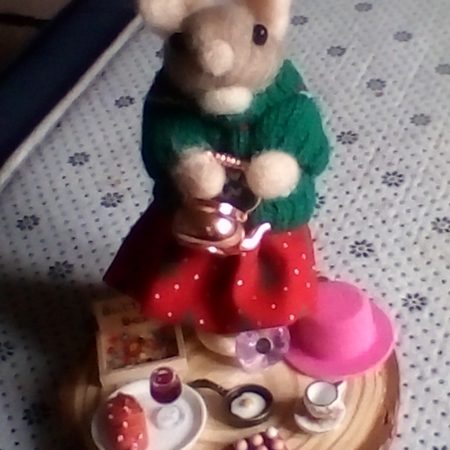 needle felted spool mouse getting ready for her lunch