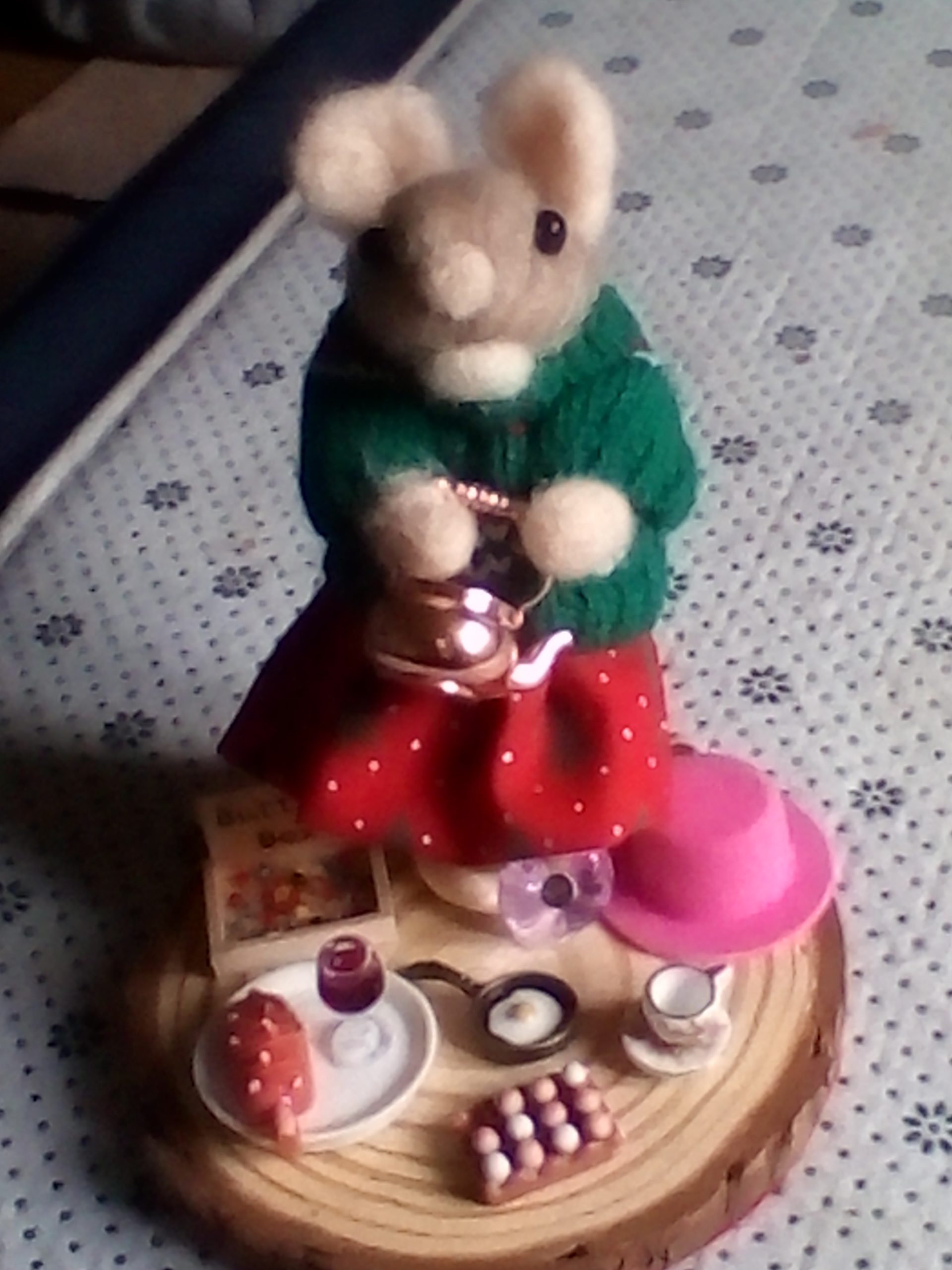 needle felted spool mouse getting ready for her lunch