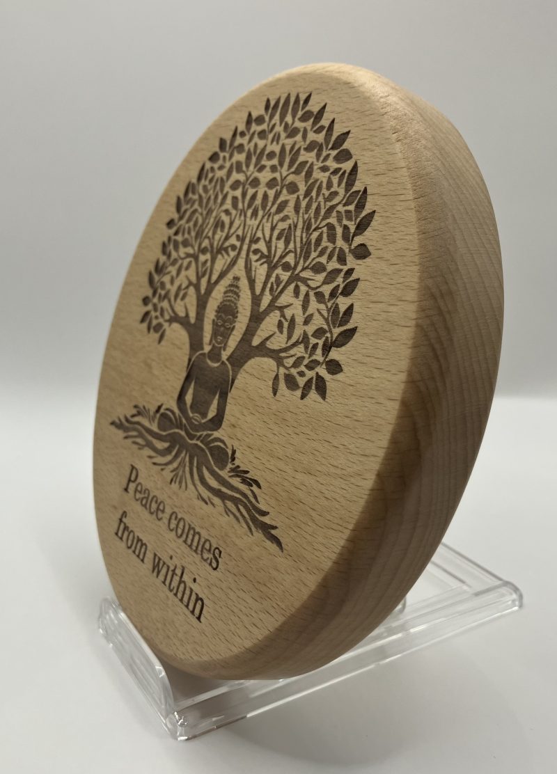 Buddha Engraved on Beech sitting under tree with words 'Peace Comes From Within'