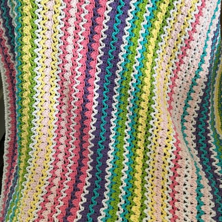 A lovely medium sized crocheted blanket 75x75cm