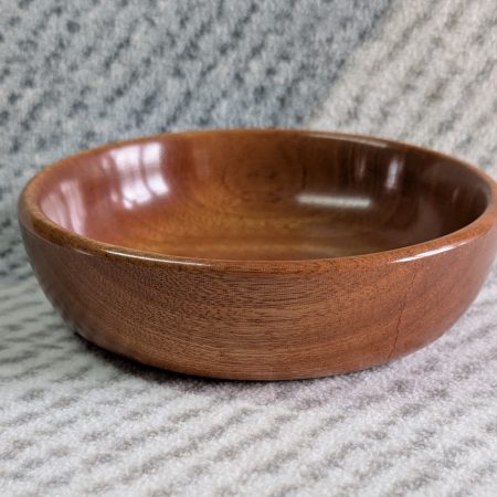 Small wooden bowl made from mahogany with a gloss finish