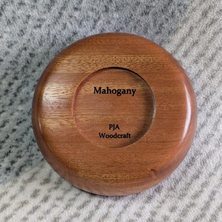 Small wooden bowl made from mahogany with a gloss finish