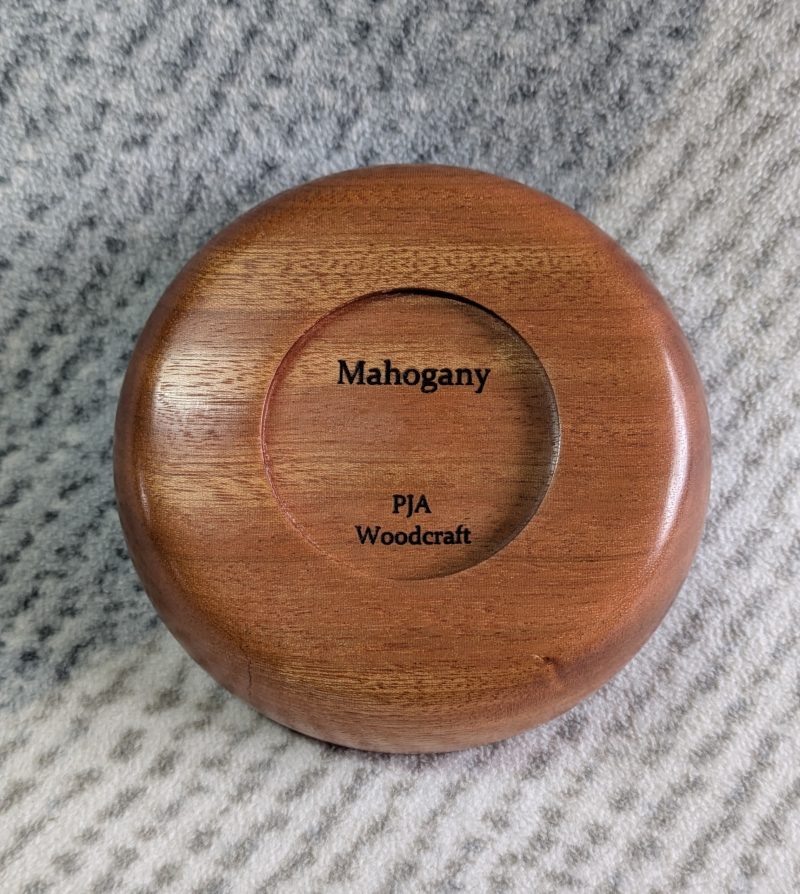 Small wooden bowl made from mahogany with a gloss finish