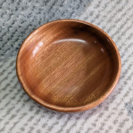 Small wooden bowl made from mahogany with a gloss finish