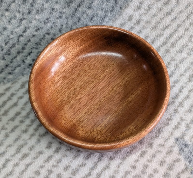 Small wooden bowl made from mahogany with a gloss finish