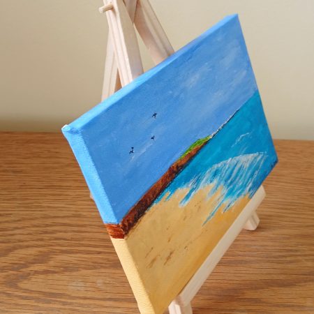 Filey Brigg hand painted canvas with easel for display
