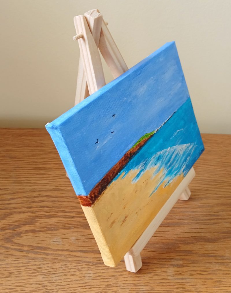Filey Brigg hand painted canvas with easel for display