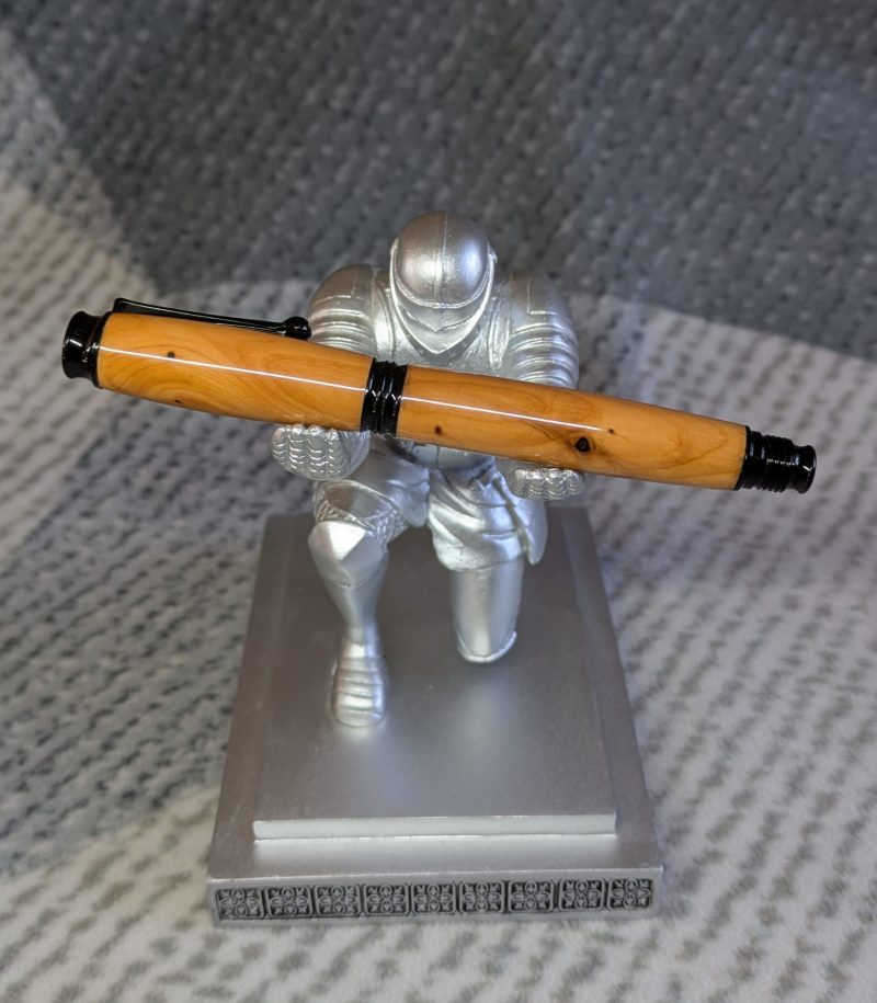 Omega style wooden rollerball made from yew with black fittings