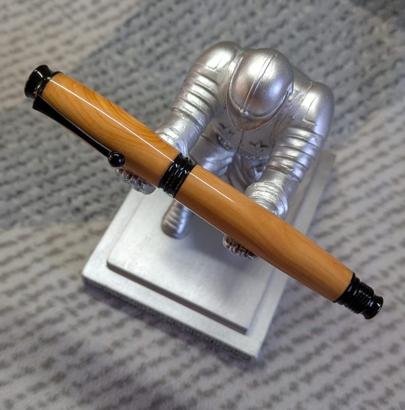 Omega style wooden rollerball made from yew with black fittings
