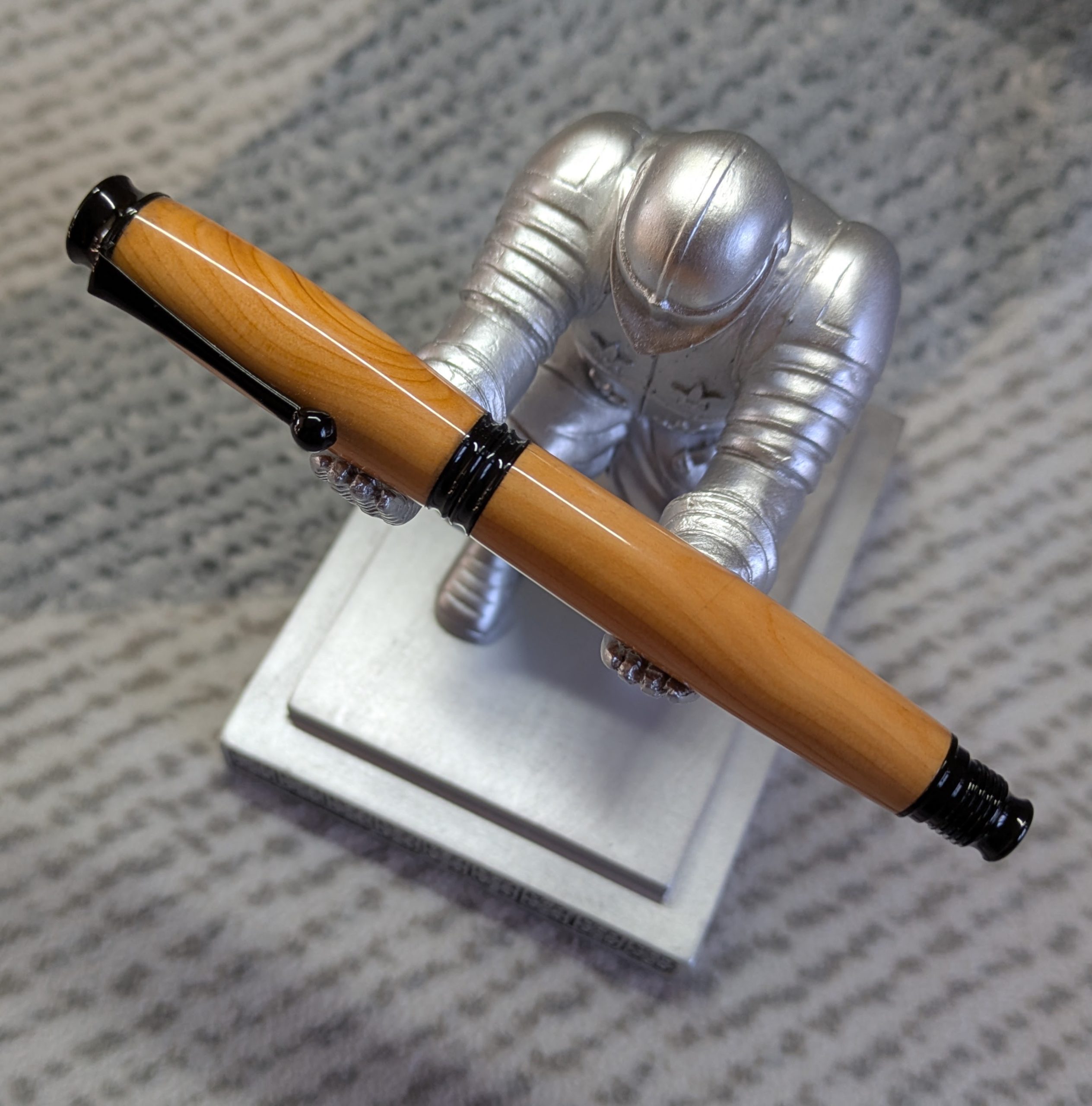 Omega style wooden rollerball made from yew with black fittings