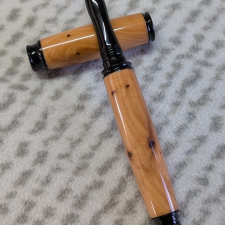 Omega style wooden rollerball made from yew with black fittings