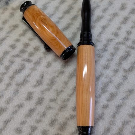 Omega style wooden rollerball made from yew with black fittings