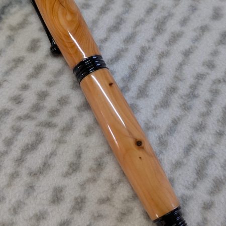 Omega style wooden rollerball made from yew with black fittings