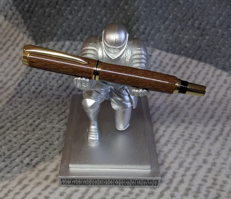 Wooden fountain pen made from gombeira wood with gold coloured fittings