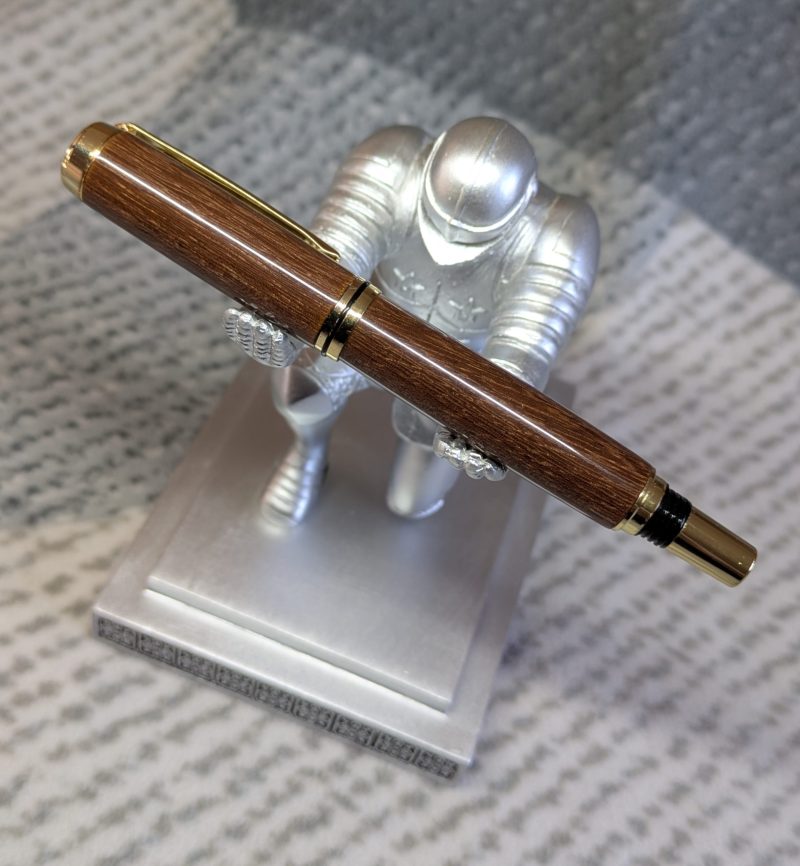 Wooden fountain pen made from gombeira wood with gold coloured fittings