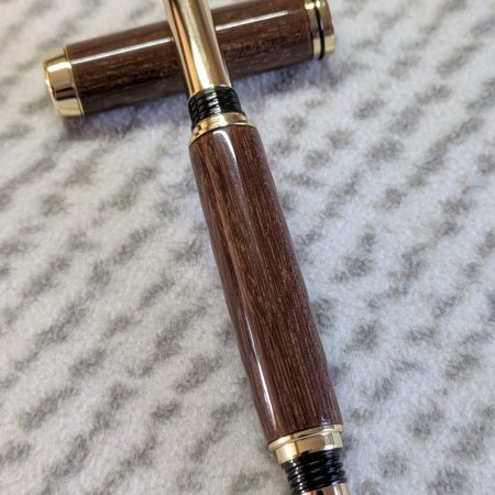 Wooden fountain pen made from gombeira wood with gold coloured fittings