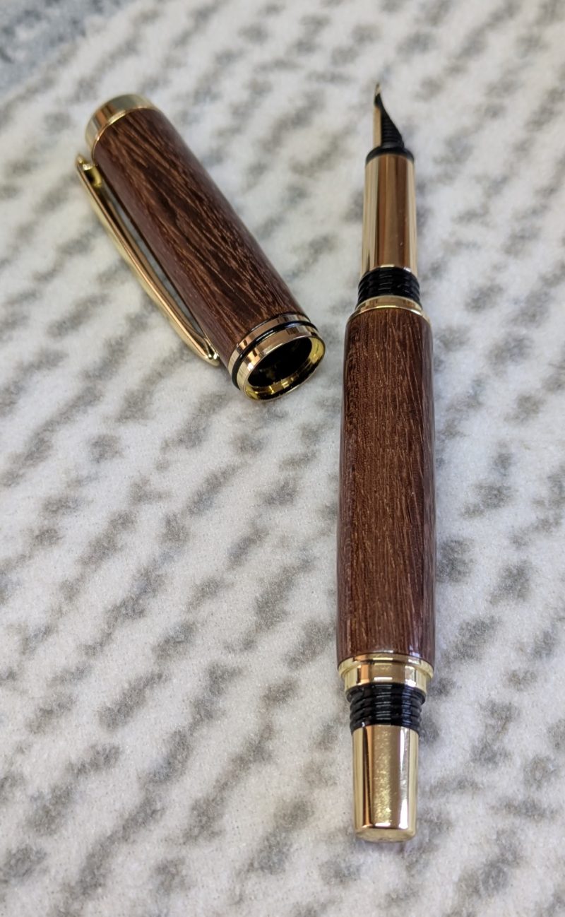 Wooden fountain pen made from gombeira wood with gold coloured fittings