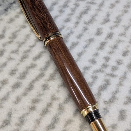 Wooden fountain pen made from gombeira wood with gold coloured fittings