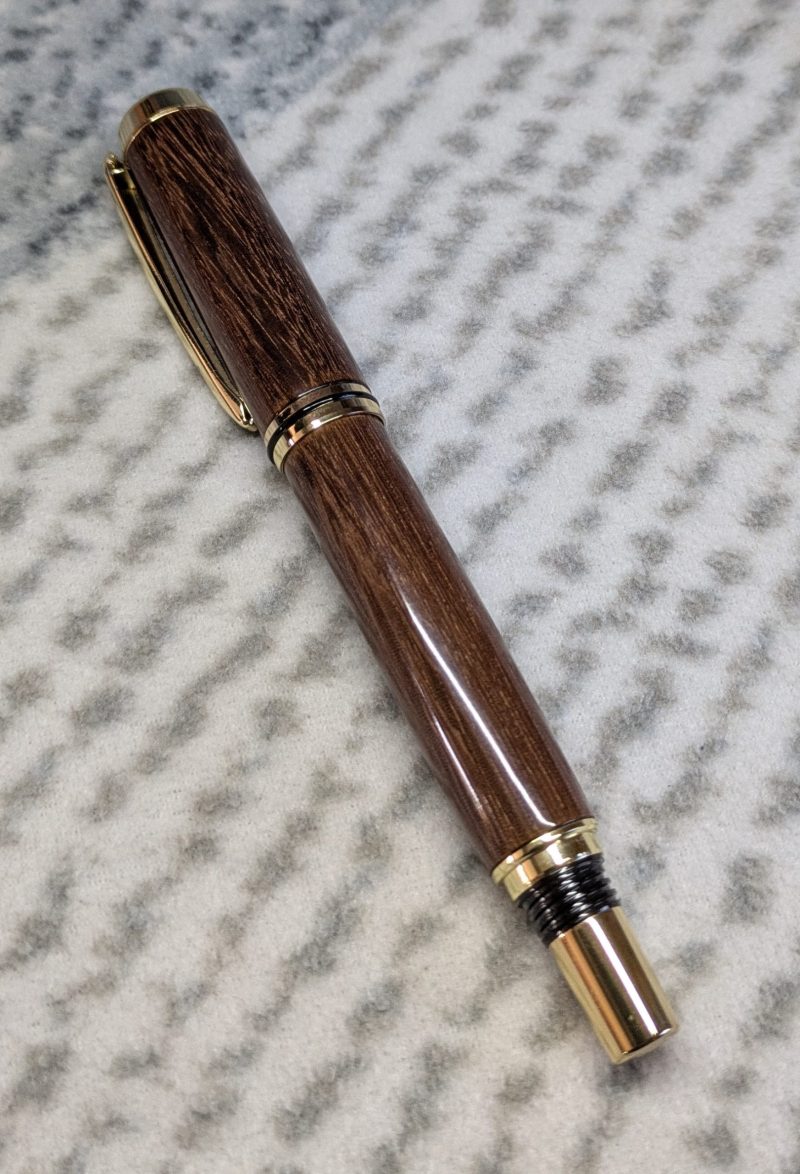 Wooden fountain pen made from gombeira wood with gold coloured fittings