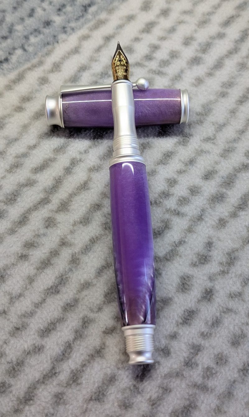 Omega style fountain pen made from purple acrylic with satin silver fittings