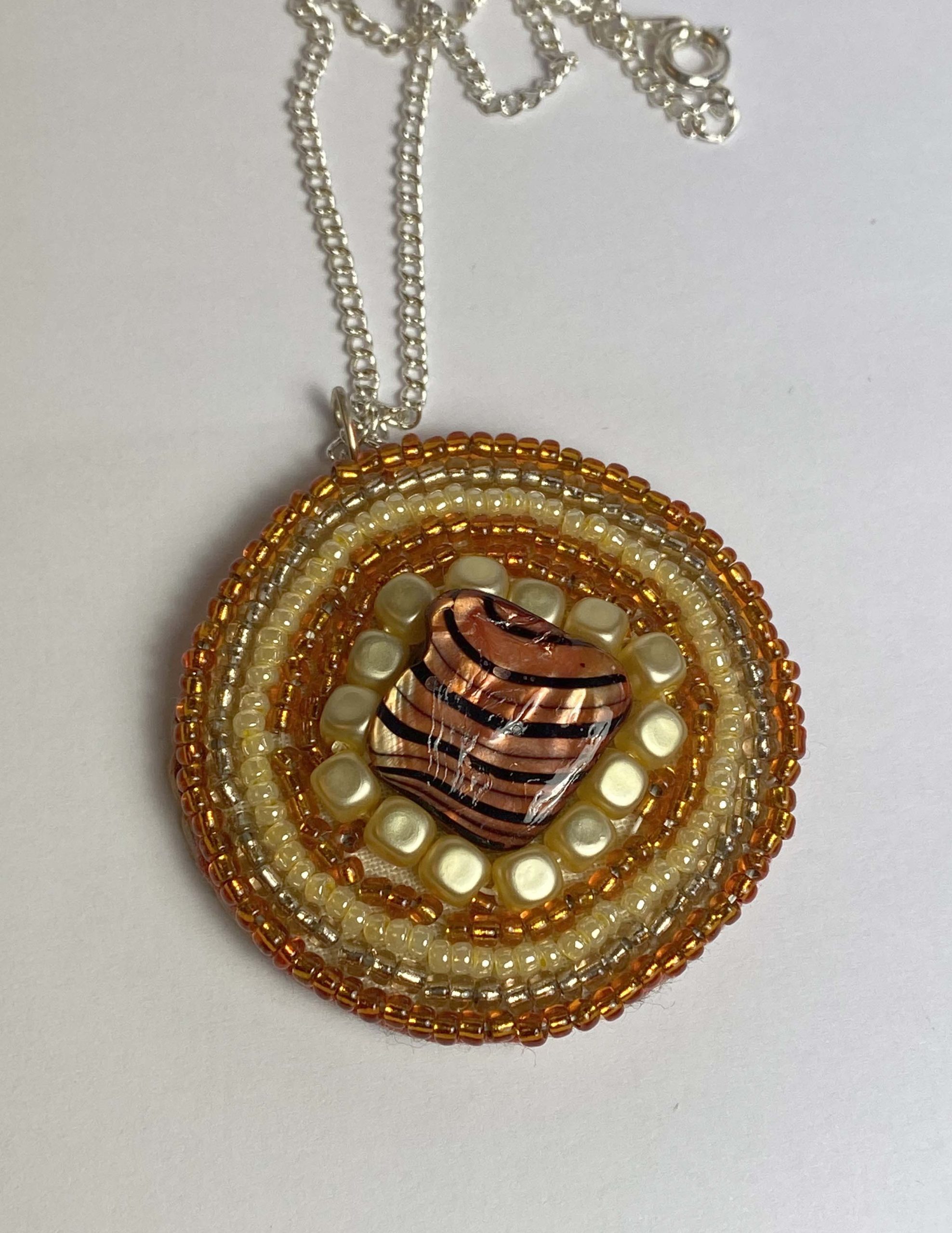 Clearance Pendant: Hand beaded medallion with shell bead at centre