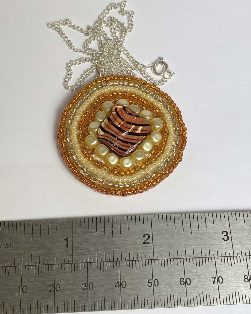 Clearance Pendant: Hand beaded medallion with shell bead at centre
