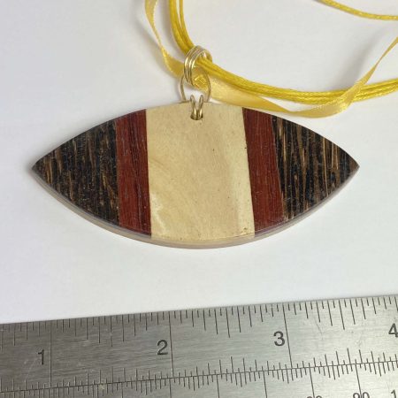 Clearance Pendant: Unusual large wooden pendant on yellow ribbon/cord