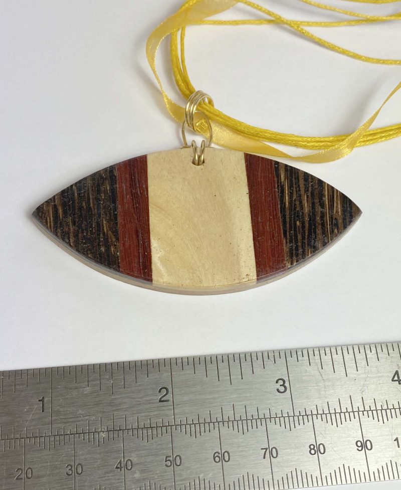 Clearance Pendant: Unusual large wooden pendant on yellow ribbon/cord