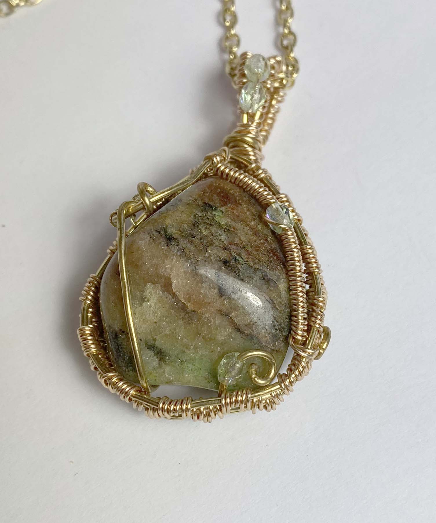 Clearance Pendant: Tumbled natural agate wrapped in gold col. wire