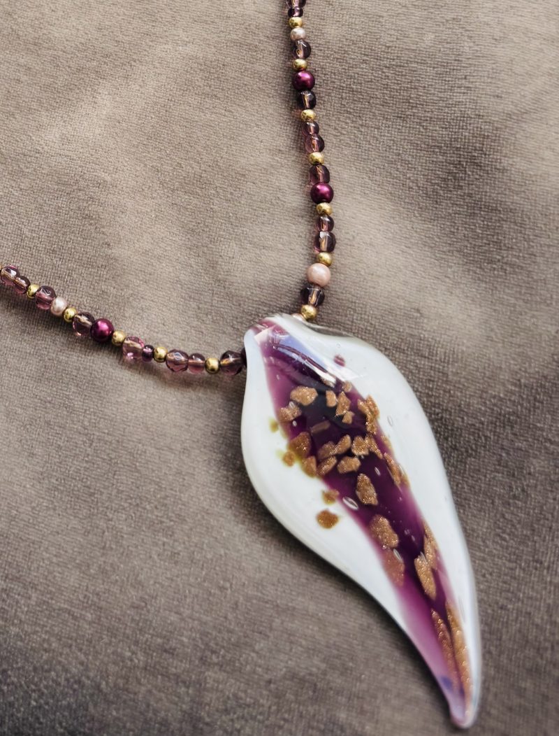 White and Burgundy resin pendant on a beaded necklace