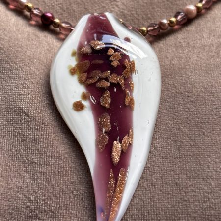 White and Burgundy resin pendant on a beaded necklace