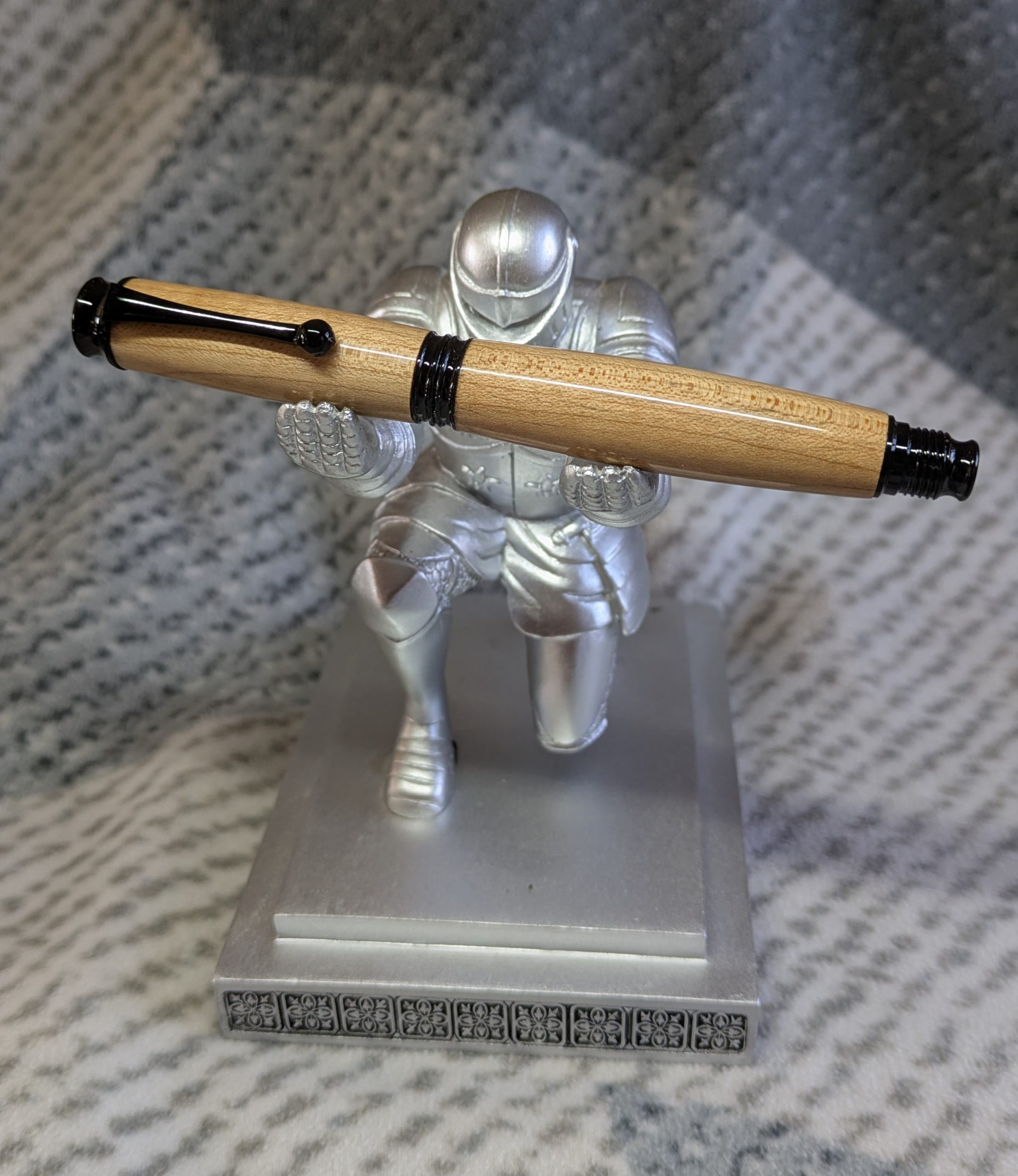 Omega style wooden rollerball made from maple with black fittings