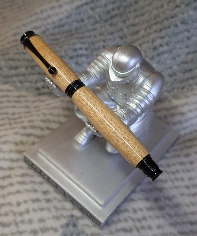 Omega style wooden rollerball made from maple with black fittings