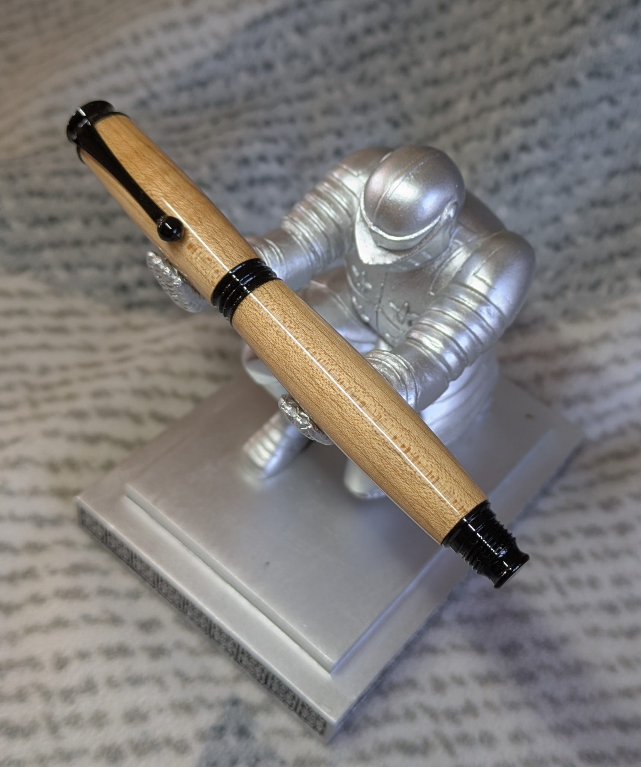 Omega style wooden rollerball made from maple with black fittings