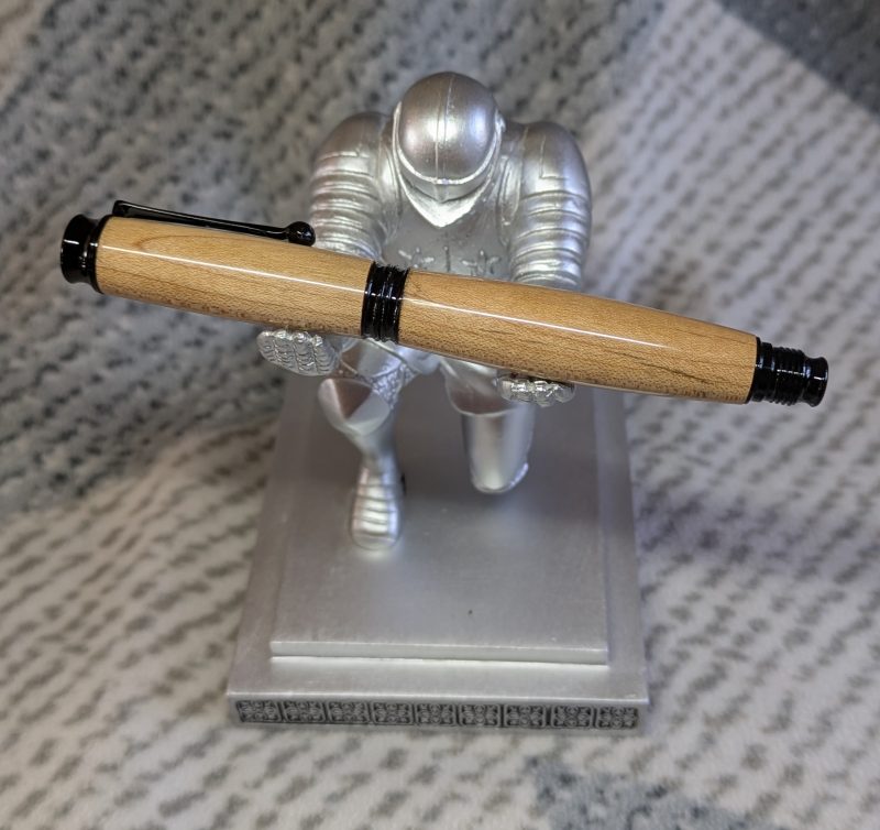 Omega style wooden rollerball made from maple with black fittings