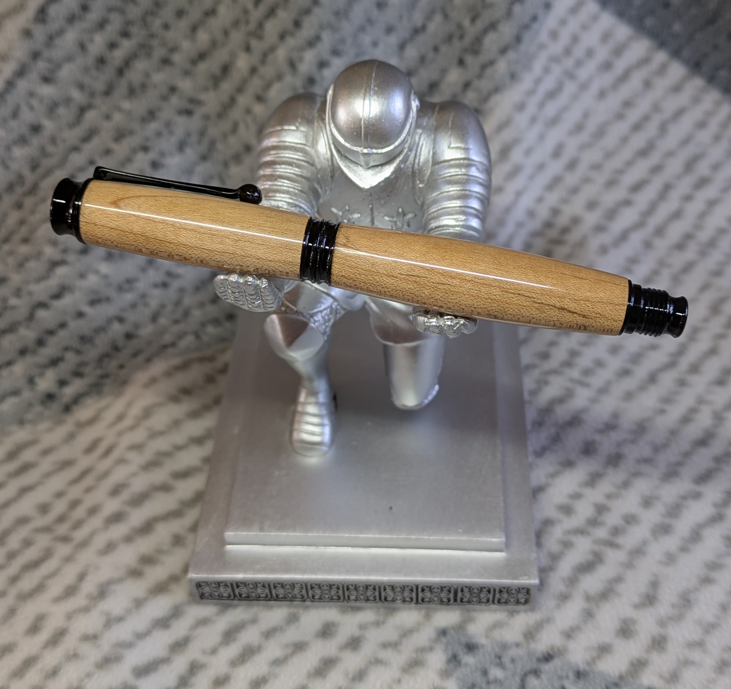 Omega style wooden rollerball made from maple with black fittings