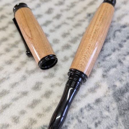 Omega style wooden rollerball made from maple with black fittings