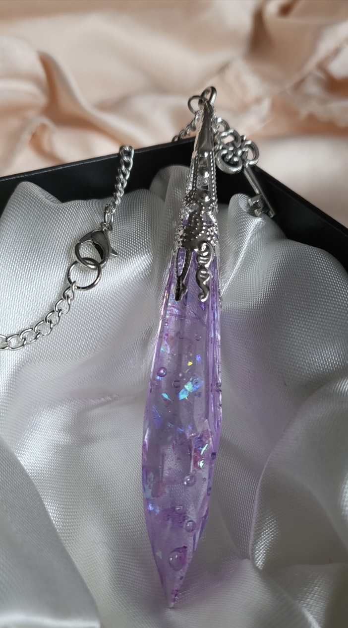 Purple shimmering potion themed crystal pendant necklace