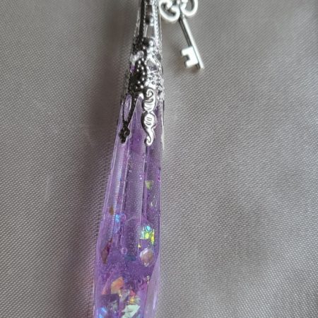 Purple shimmering potion themed crystal pendant necklace