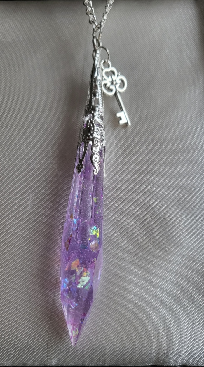 Purple shimmering potion themed crystal pendant necklace