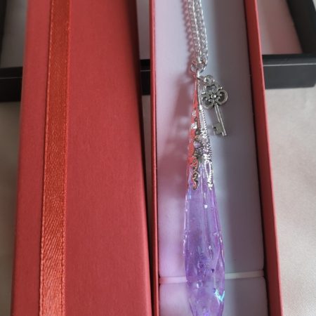 Purple shimmering potion themed crystal pendant necklace