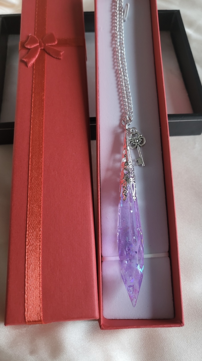 Purple shimmering potion themed crystal pendant necklace