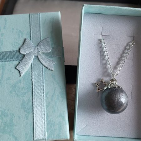 Silver moon themed resin ball necklace