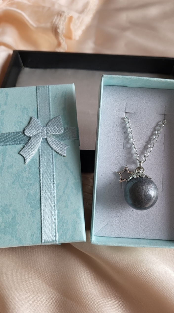 Silver moon themed resin ball necklace