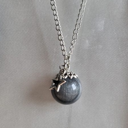 Silver moon themed resin ball necklace