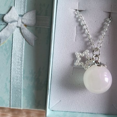 Pearlescent star themed resin ball necklace
