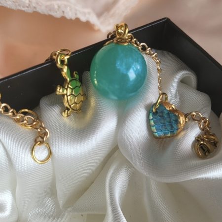 Shimmering aqua mermaid themed resin ball bracelet