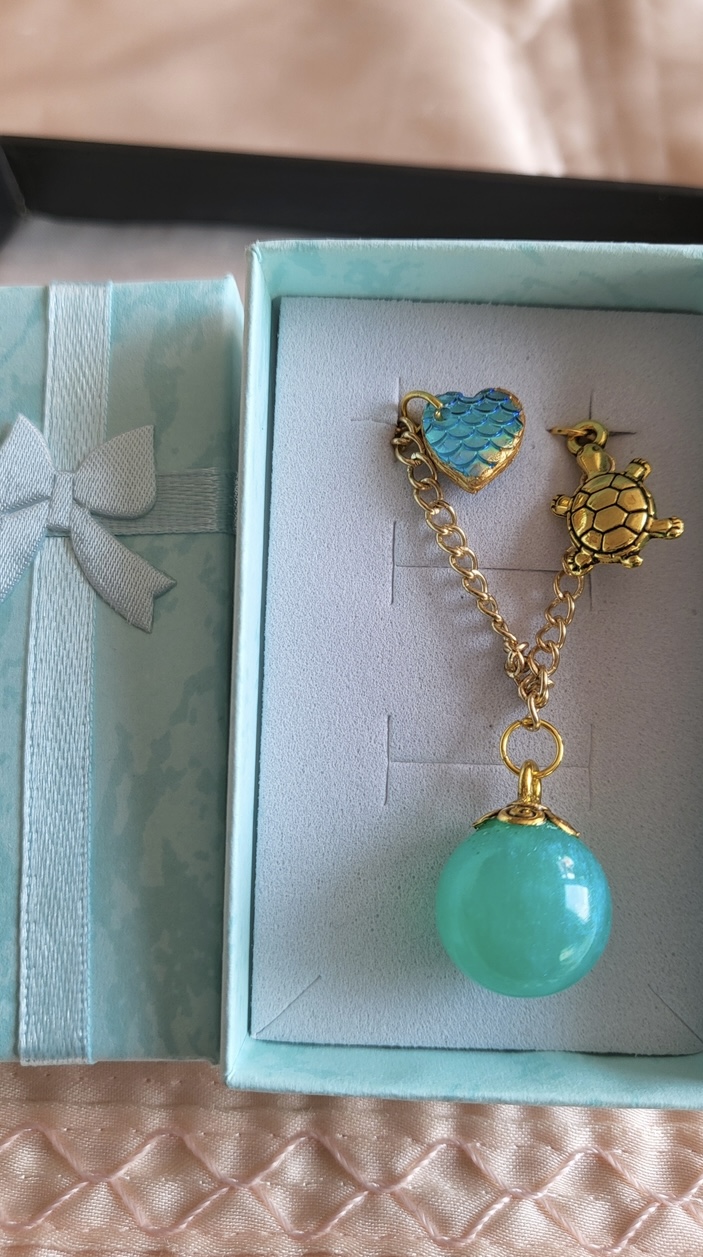 Shimmering aqua mermaid themed resin ball bracelet